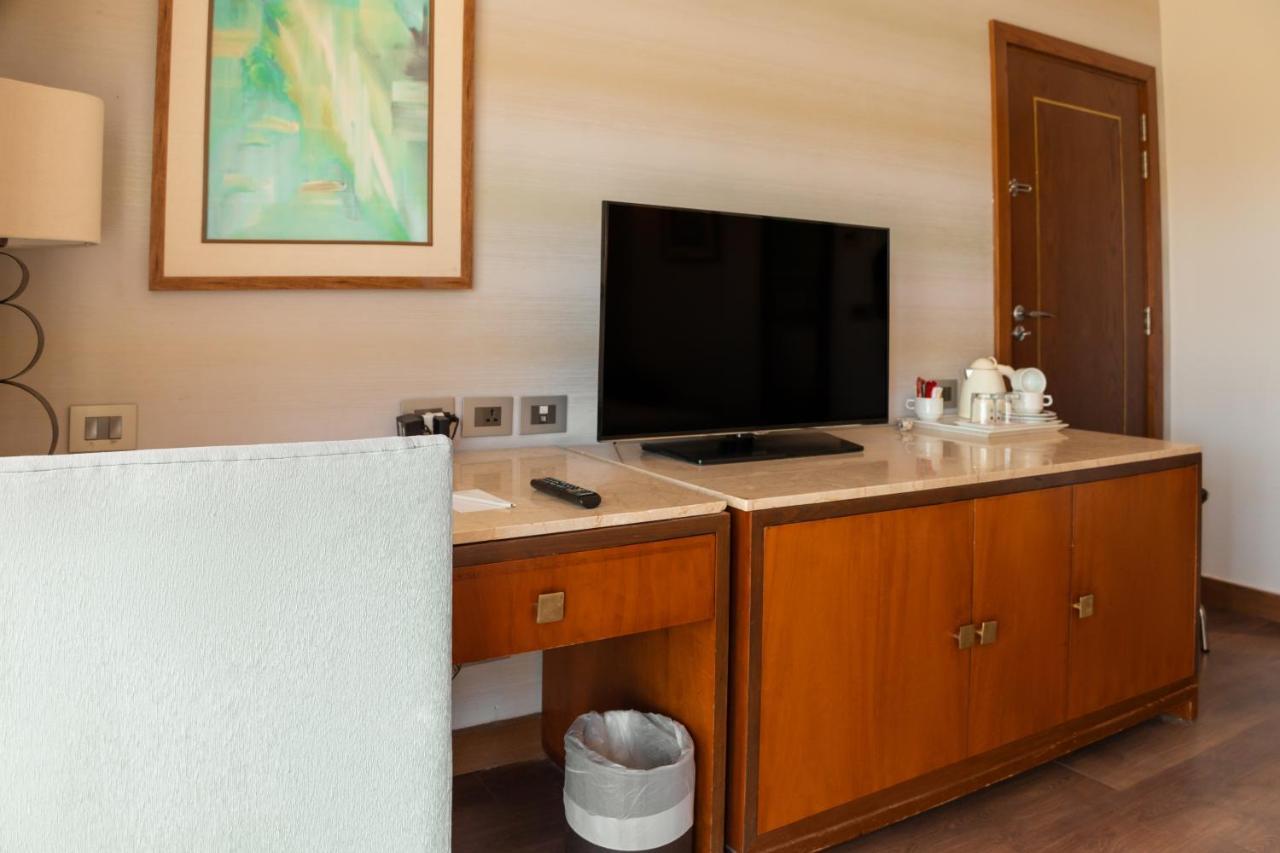 Sharm Dreams Vacation Club - Aqua Park Hotel Exterior foto A television in a hotel room