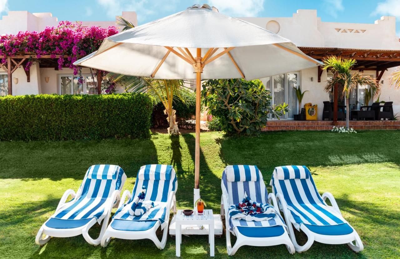 Sharm Dreams Vacation Club - Aqua Park Hotel Exterior foto A patio umbrella